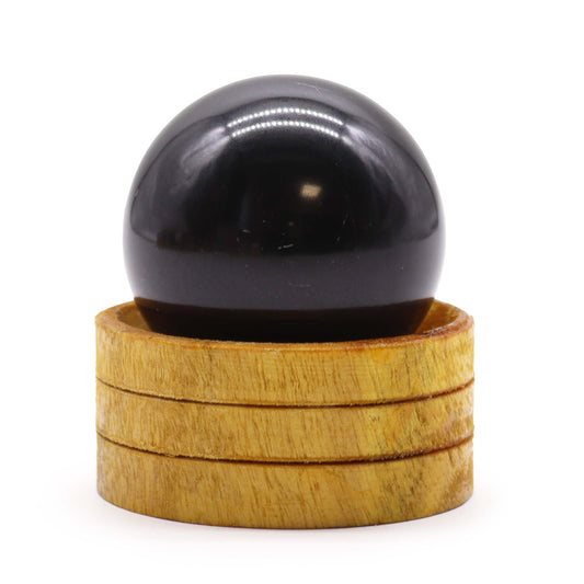 Tourmaline Crystal Sphere with Wooden Stand - Crystal Nest