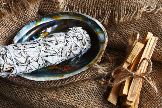 Sacred Smoke: The History and Benefits of Smudging with Sage & Palo Santo