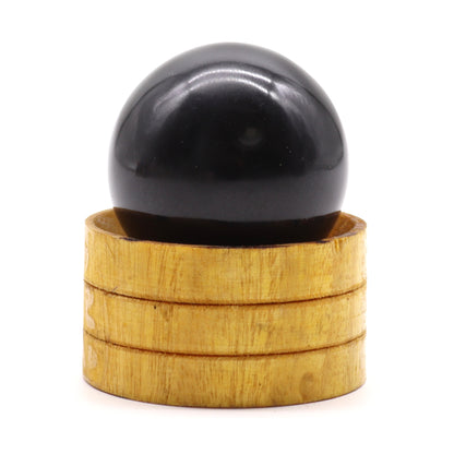 Tourmaline Crystal Sphere with Wooden Stand - Crystal Nest